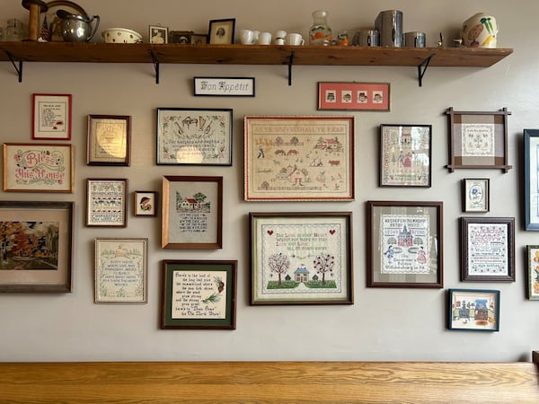 The interior of McDowell Local in downtown Marion, North Carolina is decorated in thrifted knickknacks and cross-stitched art. (Olivia Wakim for The Atlanta Journal-Constitution)