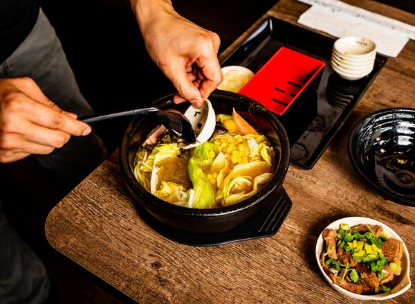 The beef curry rice noodle soup at Yunnan Crossing Bridge Rice Noodle is assembled tableside. CONTRIBUTED BY HENRI HOLLIS