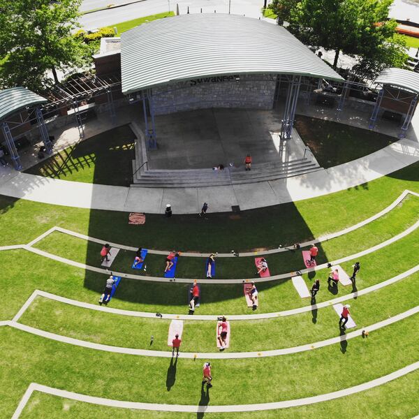 Camp Gladiator, an exercise business, began operating in Georgia in 2020 just as the coronavirus pandemic hit. It moved many classes outdoors. Here, members exercise together in the Suwannee Town Green last spring.