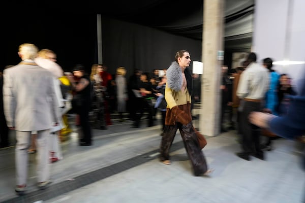 A model walks in the backstage during the Marni Fall/Winter 2025-2026 Womenswear fashion show, during the Fashion Week, in Milan, Italy, Wednesday, Feb. 26, 2025. (AP Photo/Luca Bruno)