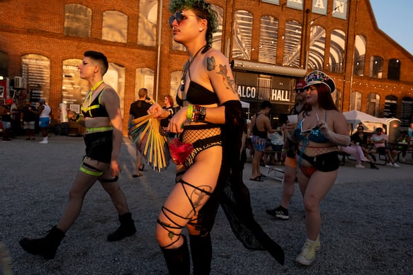 Carter Mack walks with friends while at the Chaka Khan Hacienda party at Pullman Yards on Sunday, Sept. 10, 2023. Photo by Ben Gray 
ben@bengray.com