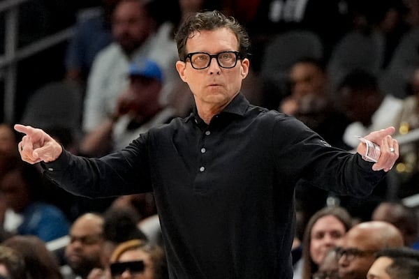 Atlanta Hawks head coach Quin Snyder speaks during the first half of an NBA basketball game against the Golden State Warriors, Saturday, March 22, 2025, in Atlanta. (AP Photo/Mike Stewart)