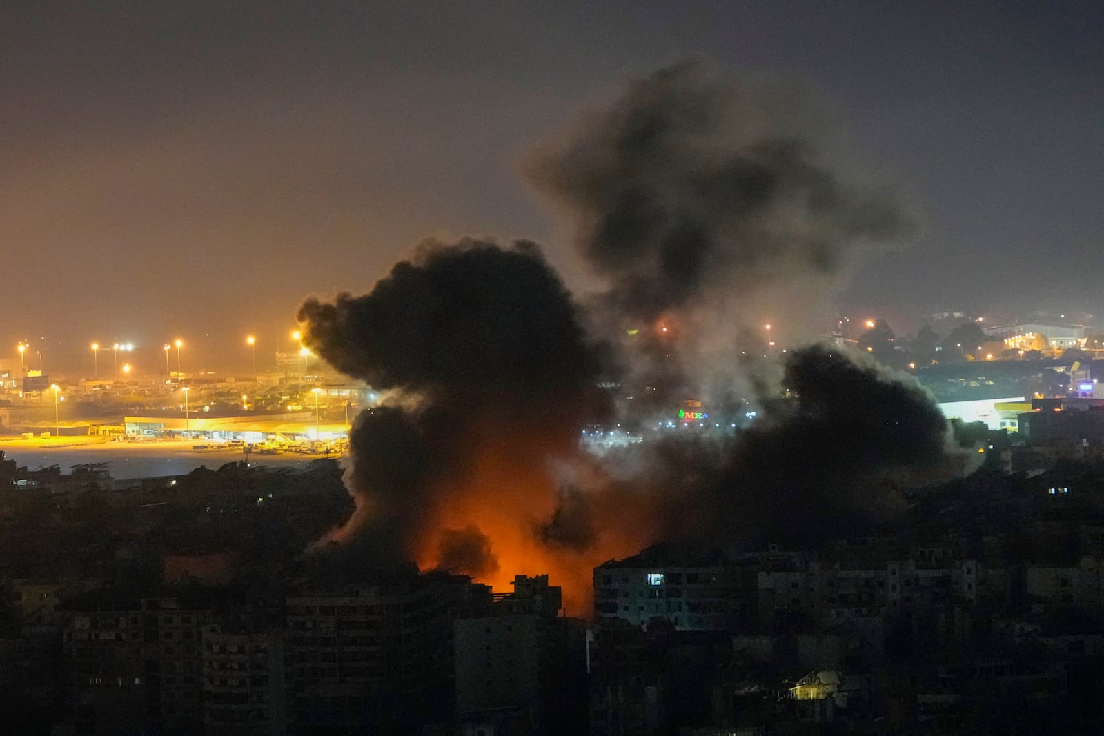 Smoke rises from an Israeli airstrike in Dahiyeh, Beirut, Lebanon, Tuesday, Oct. 22, 2024. (AP Photo/Hassan Ammar)