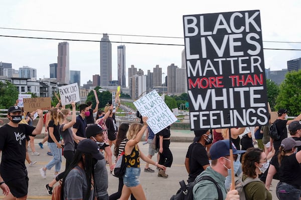 June 6, 2020 -  Atlanta - A large group of demonstrators march from the Martin Luther King center toward Piedmont park this evening as protests continued in Atlanta Saturday.   Protests over the death of George Floyd in Minneapolis police custody continued around the United States, as his case renewed anger about others involving African Americans, police and race relations.     Ben Gray for the Atlanta Journal Constitution