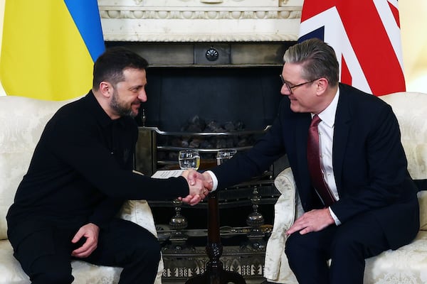 Britain's Prime Minister Keir Starmer, right, and Ukraine's President Volodymyr Zelenskyy, left, shake hands during a meeting at 10 Downing Street in London, England, Saturday, March 1, 2025. (Peter Nicholls/Pool Photo via AP)