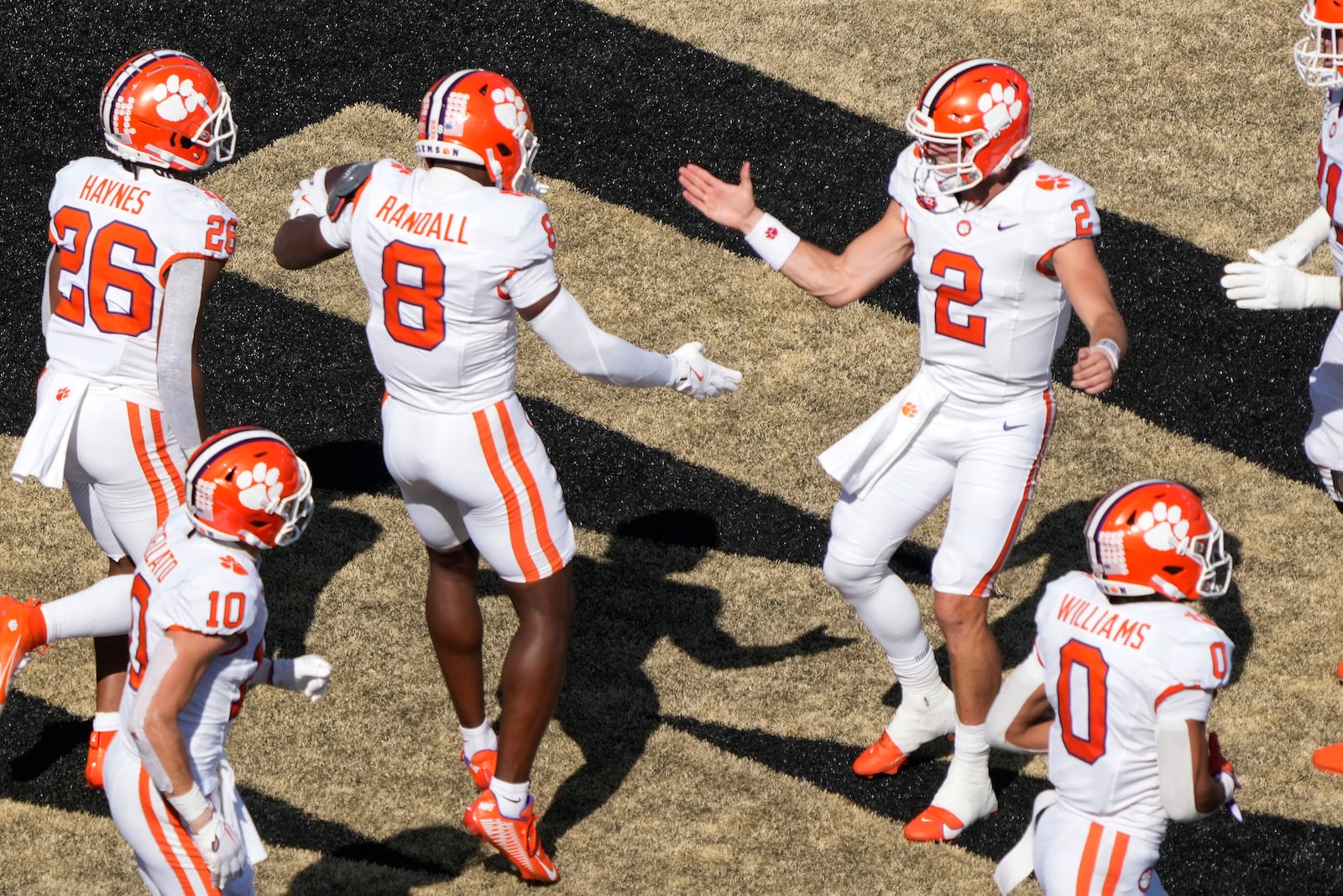 Clemson wide receiver Adam Randall (8) celebrates his touchdown against Wake Forest with quarterback Cade Klubnik (2) during the second half of an NCAA football game in Greensboro, N.C., Saturday, Oct. 12, 2024. (AP Photo/Chuck Burton)