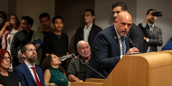 Israel's Council General in Miami, Maor Elbaz-Starinski, peaks in support of Mayor Steven Miner during an extended public speaking portion as the City Commission was expected to discuss Meiner's proposal to terminate a lease and cut financial support for O Cinema, the independent film theater on Wednesday, March 19, 2025 in Miami Beach, Fla. (Jose Iglesias /Miami Herald via AP)