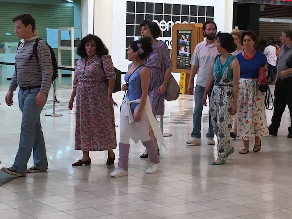 Extras for "Stranger Things" dressed in their best 1985 garb.