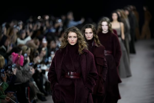 Models wear creations as part of the Max Mara Fall/Winter 2025-2026 Womenswear collection presented in Milan, Italy, Thursday, Feb. 27, 2025. (AP Photo/Antonio Calanni)