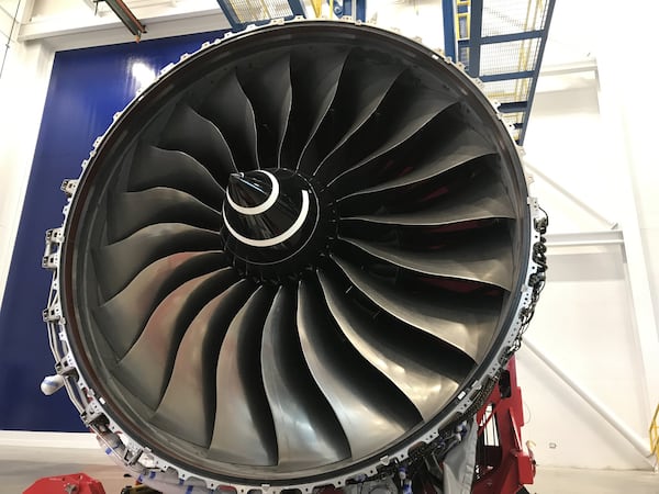 A jet engine sits in front of the door to Delta’s engine test cell on Thursday, Feb. 21, 2019, in Atlanta.