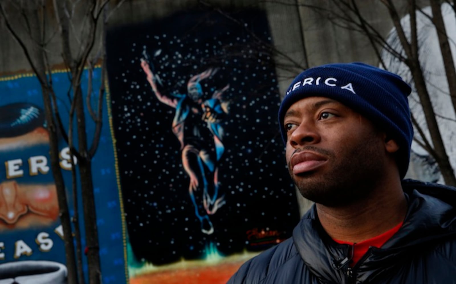 Fabian Williams stands before one of his murals in downtown Atlanta (Carolyn Cole/Los Angeles Times/TNS)