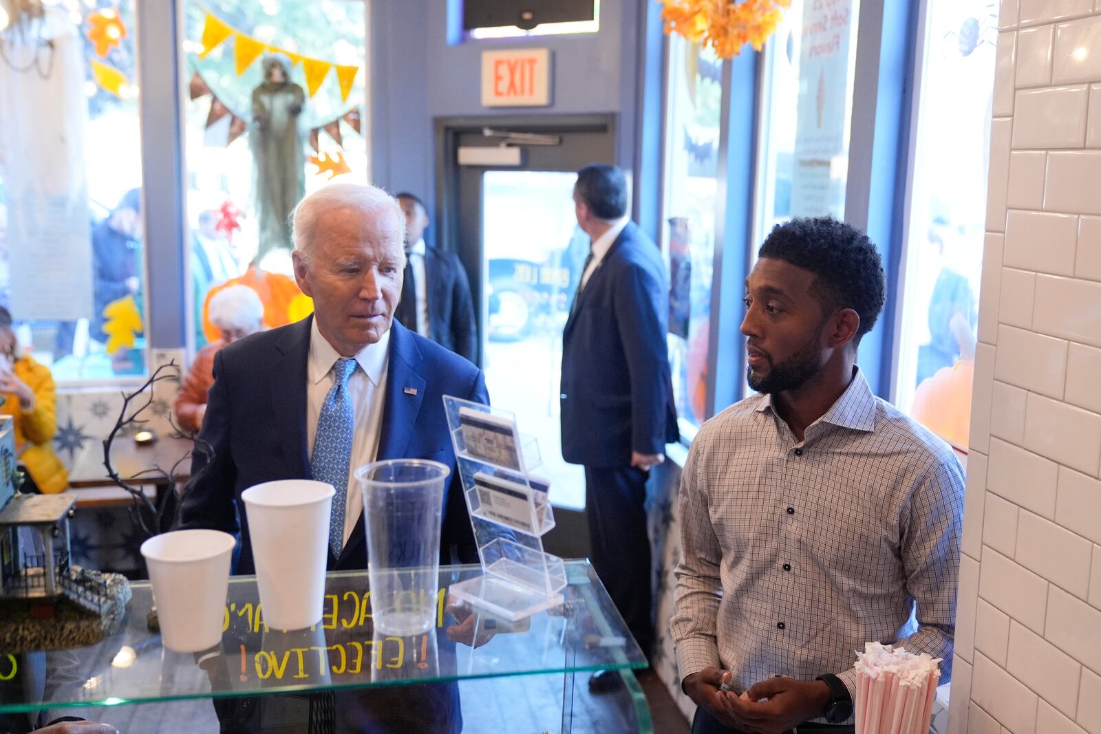 President Joe Biden walks into BMORE LICKS, a homemade ice cream business in Baltimore, Tuesday, Oct. 29, 2024, after speaking the Port of Baltimore. (AP Photo/Mark Schiefelbein)