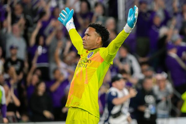 Orlando City goalkeeper Pedro Gallese celebrates in front of fans after defeating Atlanta United in an MLS Semifinal Conference playoff soccer match, Sunday, Nov. 24, 2024, in Orlando, Fla. (AP Photo/John Raoux)