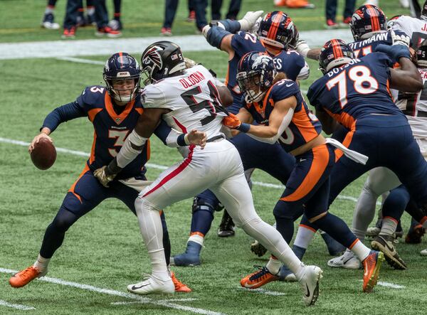 Falcons linebacker Foye Oluokun (54) sacks Denver Broncos quarterback Drew Lock (3) during the second quarter Sunday, Nov. 8, 2020, at Mercedes-Benz Stadium in Atlanta. (Alyssa Pointer / Alyssa.Pointer@ajc.com)