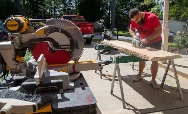 Tony Rissley works on a project outside his Sugar Hill home. PHIL SKINNER FOR THE ATLANTA JOURNAL-CONSTITUTION.