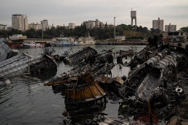 Destroyed Syrian naval vessels from previous Israeli airstrikes are seen in the port of Latakia, Syria, Monday, Dec. 16, 2024. (AP Photo/Leo Correa)