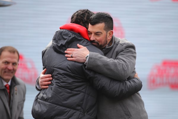 Ohio State head coach Ryan Day (facing) hugs wide receiver Emeka Egbuka during the National Championship celebration at Ohio Stadium in Columbus, Ohio, Sunday, Jan. 26, 2025. (AP Photo/Joe Maiorana)