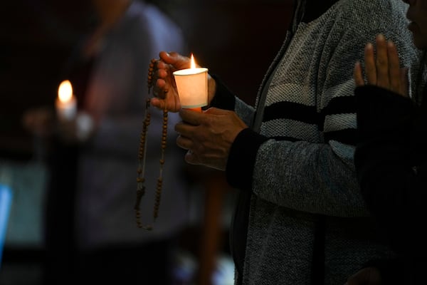 Parishioners pray for the health of Pope Francis at the Metropolitan Cathedral in Mexico City, Thursday, Feb. 27, 2025. (AP Photo/Marco Ugarte)