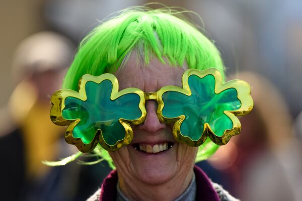 A woman wears a pair of shamrock shaped glasses during St Patrick's Day at the Cheltenham Festival at Cheltenham Racecourse on March 17, 2016 in Cheltenham, England. 