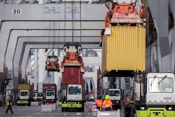 Longshoremen load and unload containers at the Georgia Ports Authority Garden City Terminal. (AJC Photo/Stephen B. Morton)

