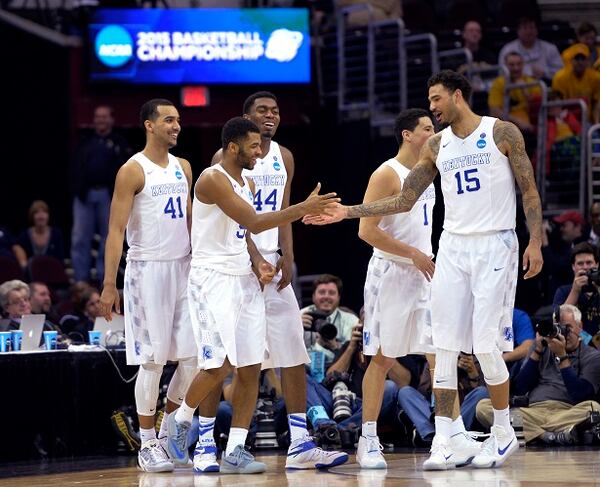 Kentucky's Andrew Harrison is congratulated by Willie Cauley-Stein (15) during the second half of a college basketball game against West Virginia in the NCAA men's tournament regional semifinals, Thursday, March 26, 2015, in Cleveland. (AP Photo/David Richard) They haven't lost. They may not. (AP photo/David Richard)