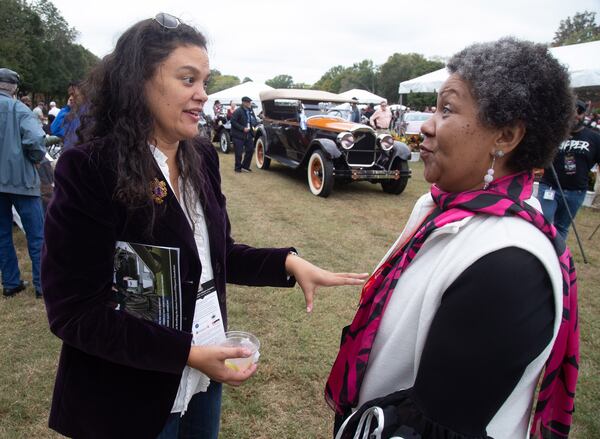 Atlanta Public Schools superintendent Meria Carstarphen (left) talk cars at the 2019 Atlanta Concours D'Elegance car show at Tyler Perry Studios in Atlanta on Sunday, October 20, 2019.  STEVE SCHAEFER / SPECIAL TO THE AJC