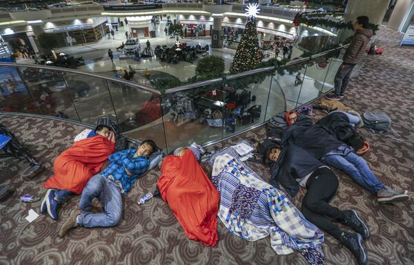 Passengers were still feeling the effects Monday of Sunday’s power outage at Hartsfield-Jackson Atlanta International Airport as they had to endure long lines to claim baggage and ride shuttles. BOB ANDRES /BANDRES@AJC.COM