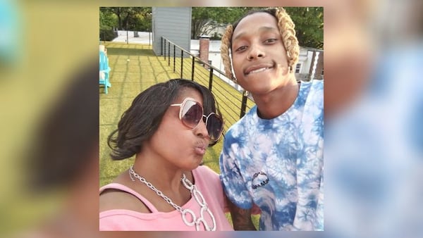 Mariolyn Dennis with her son, Keelon Tate, who was killed in a shooting last November. Three teenagers were arrested this week in connection with the killing, authorities said. 