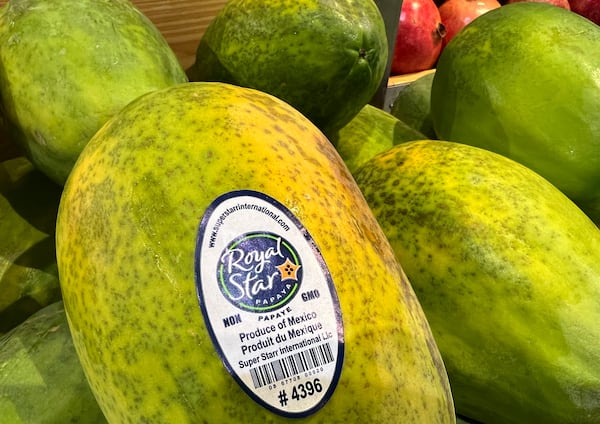 Papayas imported from Mexico are for sale in a supermarket in Miami as the United States imposed 25% tariffs on goods from Canada and Mexico, starting a trade war with its closest neighbors and allies Wednesday, March 5, 2025. (AP Photo/Lynne Sladky)