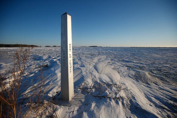 FILE - A border marker between the United States and Canada is shown just outside of Emerson, Manitoba, Thursday, Jan. 20, 2022. (John Woods/The Canadian Press via AP, File)