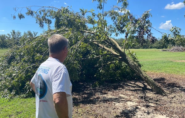 Vance Hiers, a Brooks County pecan farmer, stands in one of his orchard fields Oct. 2, 2024, roughly five days after Hurricane Helene torn through South Georgia. Instead of a thriving orchard, he's lost thousands of trees to recent hurricanes. (Zachary Hansen / AJC)