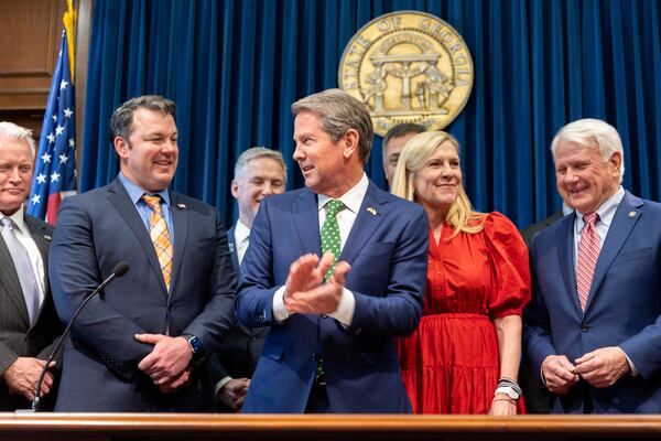 Lt. Gov. Burt Jones, left, says he is friends with both Gov. Brian Kemp, center, and former President Donald Trump. “While I always want my friends to be friends," he said, "that doesn’t always happen.” (Arvin Temkar / arvin.temkar@ajc.com)