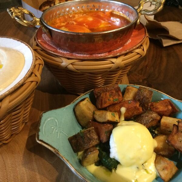 The shakshuka (top) and breakfast hash with poached egg at Rozina Bakehouse & Coffee. (Hummus is on the left.) CONTRIBUTED BY WENDELL BROCK