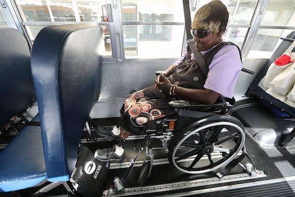  Brunswick resident Theresa Cooper, 56, waits Tuesday on one of the final buses at Lanier Plaza to evacuate from Hurricane Dorian to Columbus.   Curtis Compton/ccompton@ajc.com