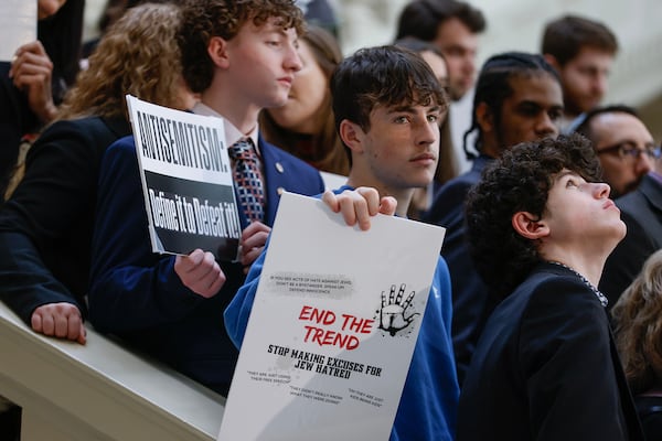 Members of the Jewish community and supporters hold signs during a press conference in February at the Georgia Capitol focusing on antisemitism. (Natrice Miller/Atlanta Journal-Constitution/TNS)