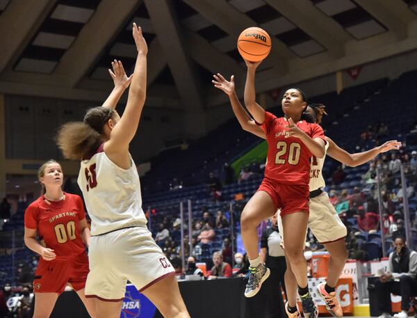 Greater Atlanta Christian's Kaleigh Addie (20) gets off a shot over Cross Creek's Jenna Wilbon (50) during the Class 3A girls title game Friday, March 12, 2021, at the Macon Centreplex in Macon. Cross Creek won 56-44. (Hyosub Shin / Hyosub.Shin@ajc.com)