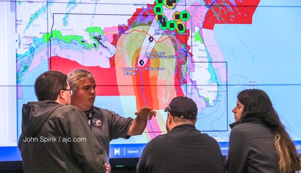 Georgia Emergency Management Agency operation center director Jeff Morrison directs staff Wednesday morning. JOHN SPINK / JSPINK@AJC.COM