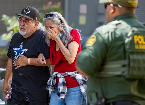 A woman cries Tuesday, May 24, 2022, as she leaves the Uvalde Civic Center, in Uvalde, Texas. At least 19 students and two adults were killed when a gunman opened fire at Robb Elementary School in Uvalde, according to Texas Gov. Gregg Abbott. (William Luther/San Antonio Express-News/Zuma Press/TNS)