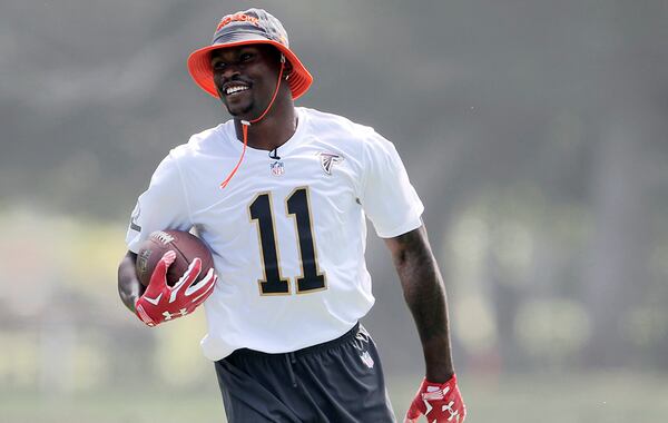 Falcons wide receiver Julio Jones carries the ball during Team Irvin's practice Thursday in Kahuku, Hawaii. (Marco Garcia/AP)