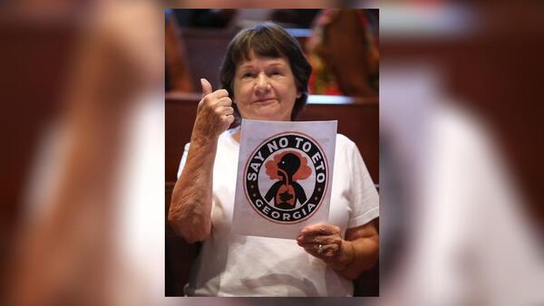 Carolyn Garing, of  Covington, gives the thumbs up sign during the town hall meeting on ethylene oxide gas from the nearby Becton Dickinson plant. Curtis Compton/ccompton@ajc.com