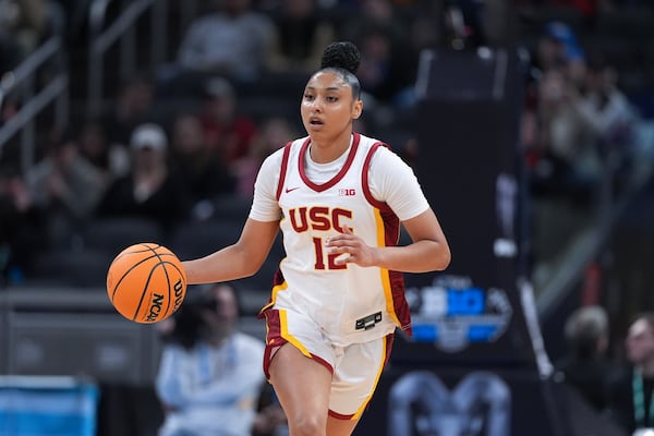 Southern California guard JuJu Watkins (12) plays against UCLA during the first half of an NCAA college basketball game in the championship of the Big Ten Conference tournament in Indianapolis, Sunday, March 9, 2025. (AP Photo/Michael Conroy)