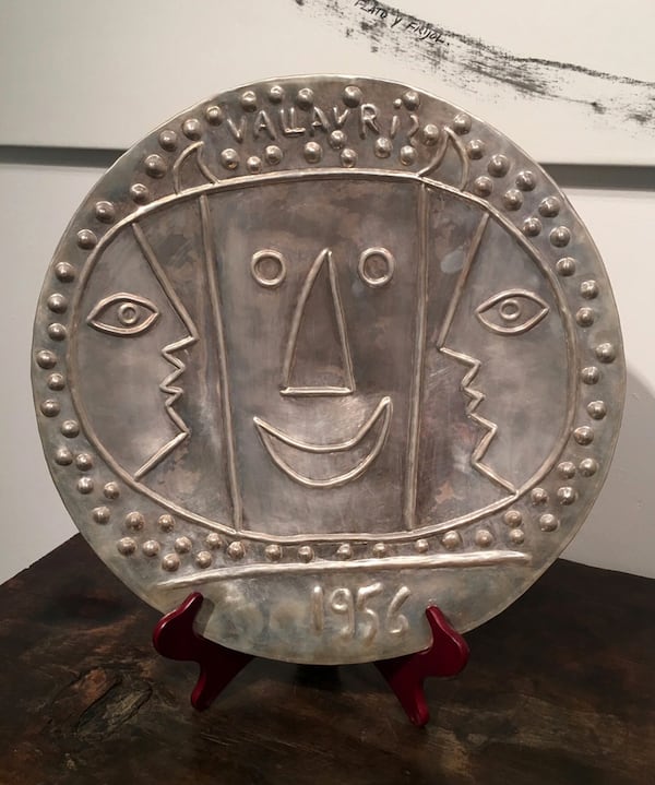 This photo taken Wednesday, Aug. 9, 2017 photo and provided by Objects of Art, one of two cast silver platters designed by Pablo Picasso is displayed as part of the four-day Objects of Art exhibition in Santa Fe, N.M. The exhibit runs through Sunday Aug. 13, 2017. (Objects of Art via AP)