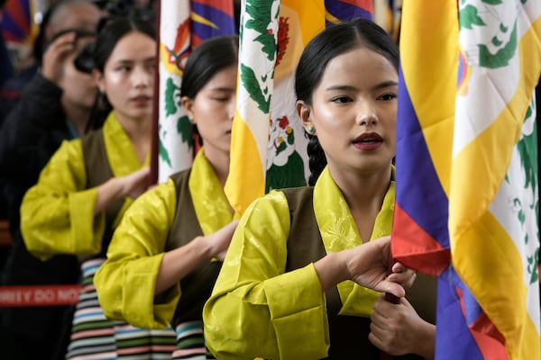 Exiled Tibetan artists sing a song to mark the 66th anniversary of an uprising in Tibetan capital Lhasa, as they gather at the Tsuglakhang temple in Dharamshala, India, Monday, March 10, 2025. (AP Photo/Ashwini Bhatia)