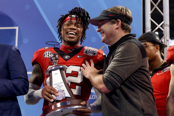 Georgia head coach Kirby Smart celebrates with defensive MVP defensive back Javon Bullard after Georgia’s 42-41 win against Ohio State in the Peach Bowl Playoff Semifinal, at Mercedes-Benz Stadium, Sat., Dec. 31, 2022, in Atlanta. Bullard was named defensive MVP of the Peach bowl, and of the championship game win over TCU. (Jason Getz / Jason.Getz@ajc.com)