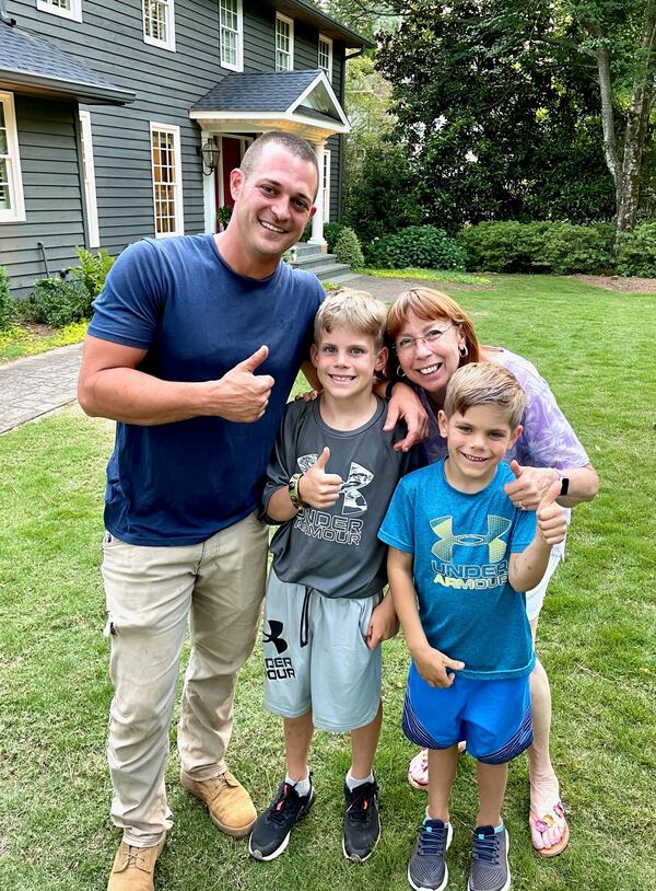 Rett Godfrey, 8, (center) and his brother, Foster, 6, are likely alive because the quick thinking and bravery of Joey Boassy and Mary Ellen Merriam. (Credit: Photo courtesy of Scott Godfrey)