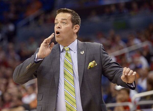 Steve Masiello, shown coaching Manhattan against Louisville. (Phelan M. Ebenhack/AP)