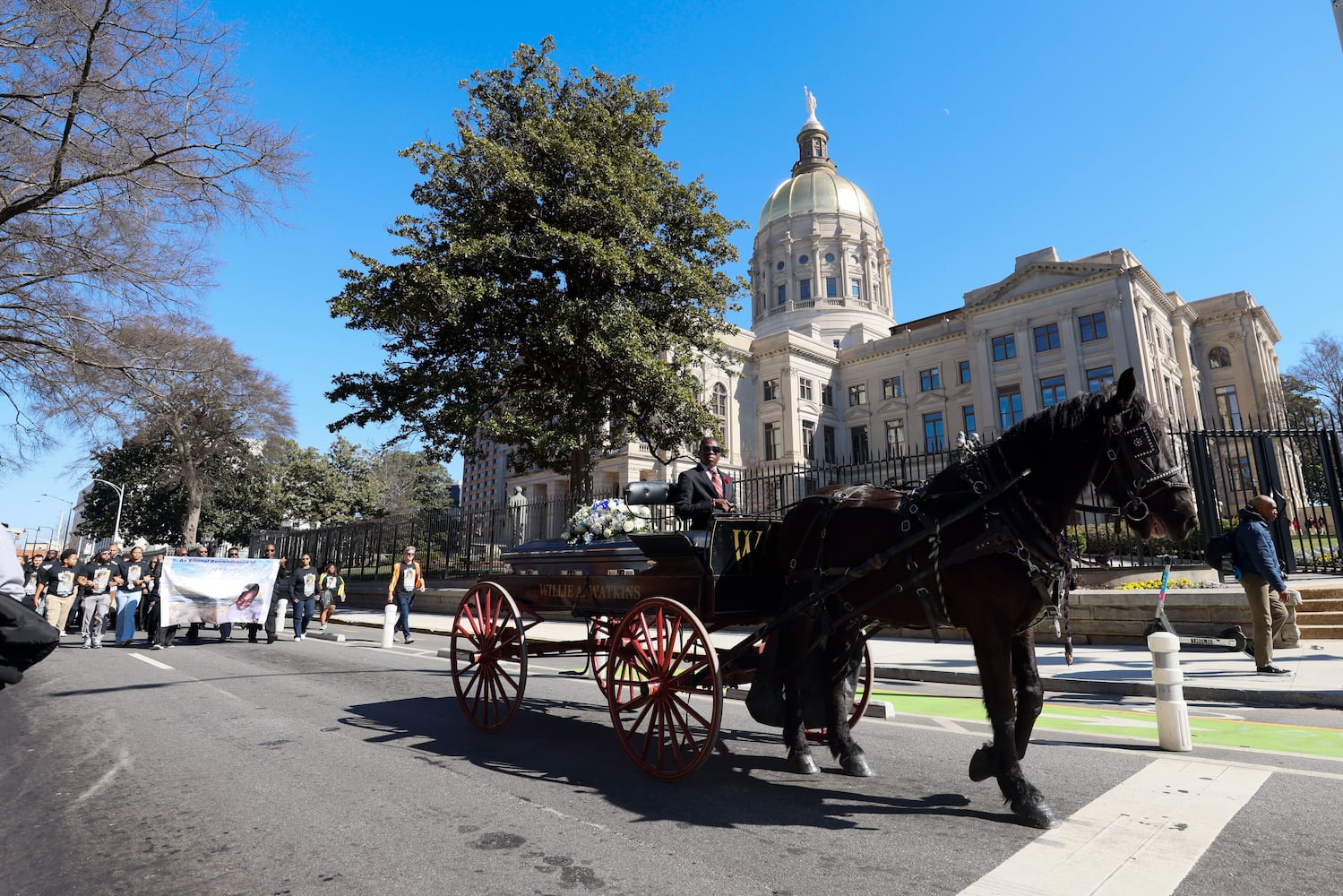 Family and friends participated in a processional led by a horse-drawn carriage carrying the remains of Cornelius Taylor from Ebenezer to Atlanta City Hall on Monday, February 3, 2025. Taylor, a homeless man, died during an incident involving city workers clearing a homeless encampment on January 16.
(Miguel Martinez/ AJC)