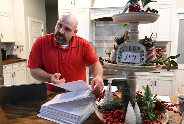 Phillip "Bunky" Crawford, who was arrested and charged with 11 felony and misdemeanor charges for his actions on Jan. 6, 2021, talks about the charges at his home in Bremen on Thursday, Dec. 19, 2024. Crawford is awaiting sentencing. (Hyosub Shin/AJC)