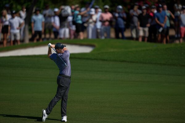 Rory McIlroy of Northern Ireland plays his second shot on the 3rd hole during the second round of World Tour Golf Championship in Dubai, United Arab Emirates, Friday, Nov. 15, 2024. (AP Photo/Altaf Qadri)