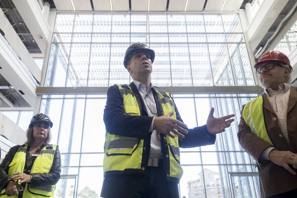 11-13-2017 - Sandy Springs, GA - Dietmar Exler (center), 49, President and CEO of Mercedes-Benz USA, gives members of the press a tour of the future Mercedes-Benz USA headquarters in Sandy Springs, Georgia, on Monday, Nov. 13, 2017. The site, which is currently under construction, is expected to be finished late in the first quarter of 2018. (CASEY SYKES, CASEY.SYKES@AJC.COM)